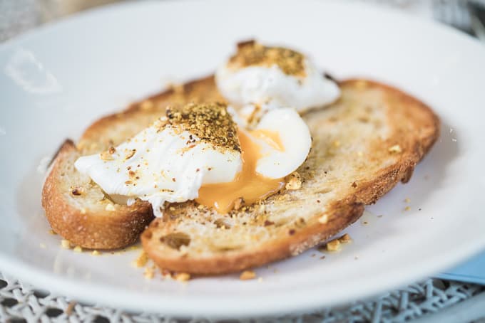 Poached Eggs with Dukkah on sourdough by The Roots Espresso