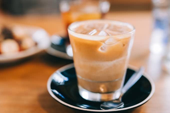 An expertly made iced latte at Sando Bar